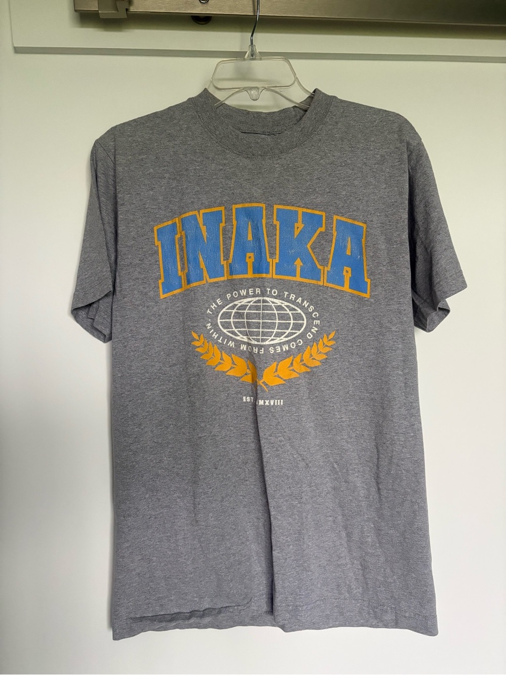 Inaka Power Gray Graphic Tee with Blue and Yellow Logo